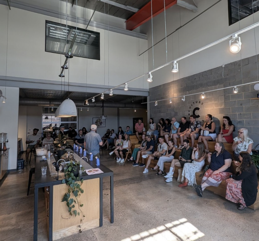 Counter Culture Coffee — a coffee education event at the Durham training centre, with an audience seated on tiered benches inside an industrial-style space